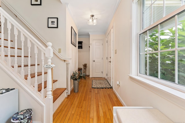 41 Arlington Rd, Stamford, CT 06902 - foyer entrance with stairway, light wood-style floors, ornamental molding, and plenty of natural light