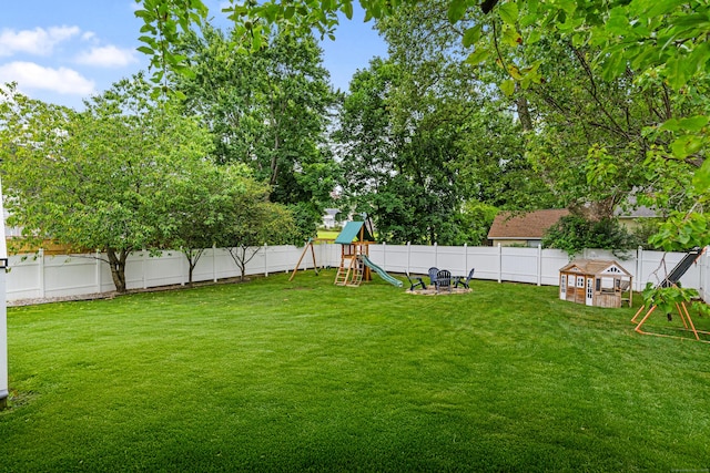 41 Arlington Rd, Stamford, CT 06902 - fenced backyard with a playground and an outbuilding