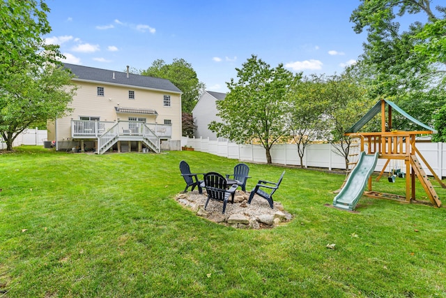 41 Arlington Rd, Stamford, CT 06902 - fenced backyard featuring a fire pit, stairs, a playground, and a wooden deck