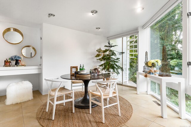 274 Nod Rd, Ridgefield, CT 06877 - dining area featuring light tile patterned flooring and a wall of windows
