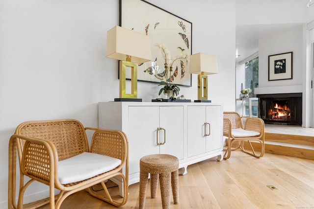 274 Nod Rd, Ridgefield, CT 06877 - sitting room featuring wood finished floors and a warm lit fireplace
