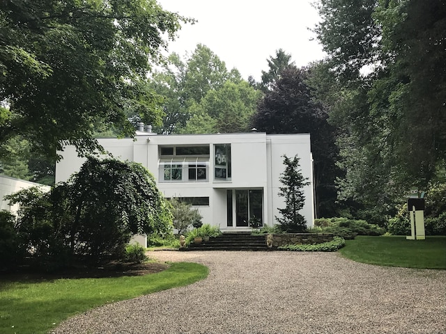 274 Nod Rd, Ridgefield, CT 06877 - rear view of house with stucco siding and driveway