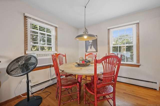 6 Fern St, Norwalk, CT 06854 - dining space with baseboard heating, healthy amount of natural light, and wood finished floors