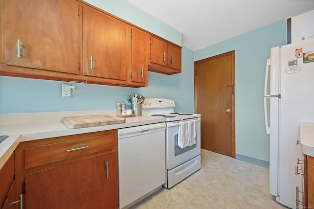 6 Fern St, Norwalk, CT 06854 - kitchen featuring white appliances, brown cabinets, and light countertops