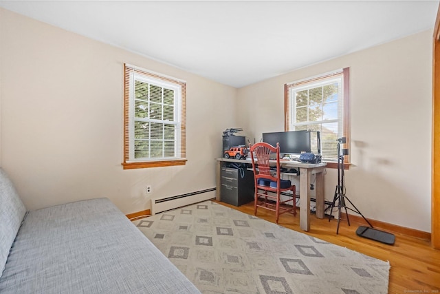 6 Fern St, Norwalk, CT 06854 - bedroom with baseboard heating, multiple windows, wood finished floors, and a desk