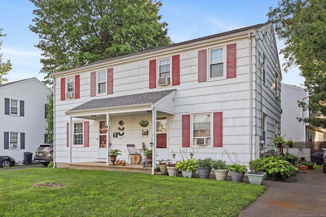 6 Fern St, Norwalk, CT 06854 - view of front of property with a front yard, cooling unit, and a porch