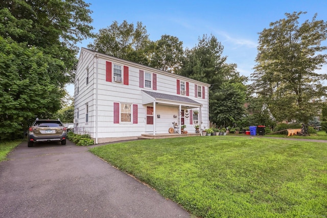 6 Fern St, Norwalk, CT 06854 - colonial home featuring a front lawn and asphalt driveway