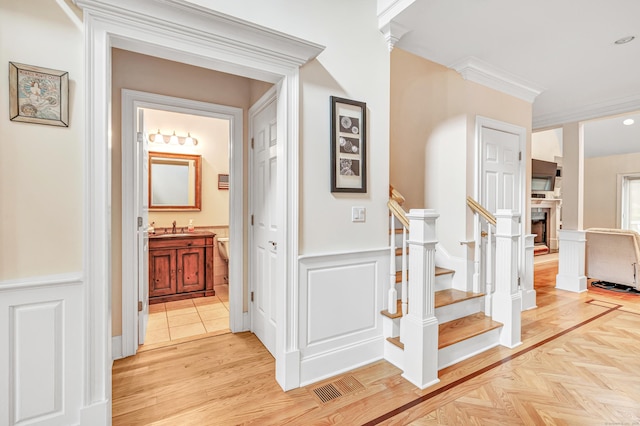 28 Aldo Dr, Woodbridge, CT 06525 - corridor with wainscoting, stairway, and a decorative wall