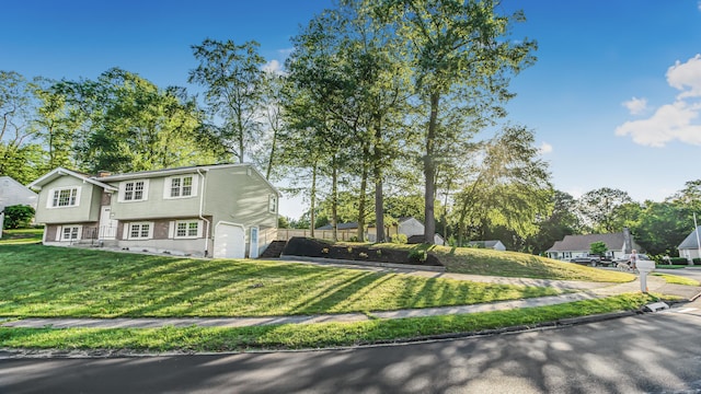 151 Stevenson Rd, Meriden, CT 06451 - view of front facade with an attached garage and a front lawn