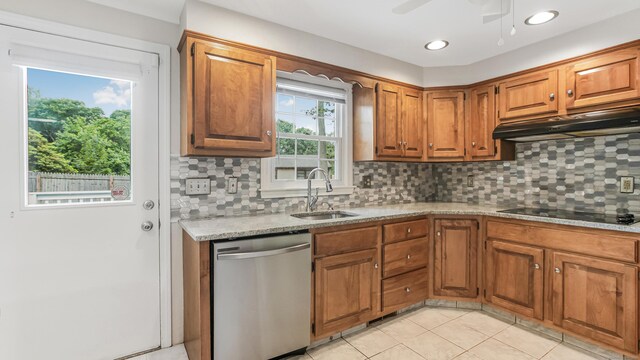151 Stevenson Rd, Meriden, CT 06451 - kitchen with stainless steel dishwasher, black electric stovetop, under cabinet range hood, brown cabinets, and recessed lighting