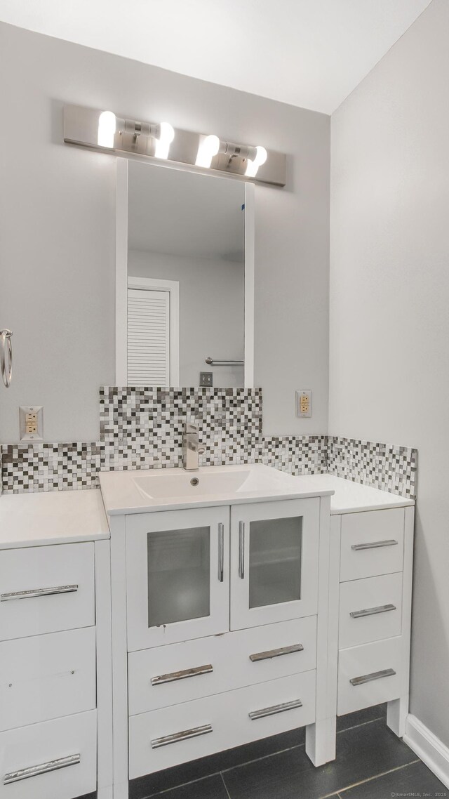 151 Stevenson Rd, Meriden, CT 06451 - bathroom with backsplash, vanity, and tile patterned floors