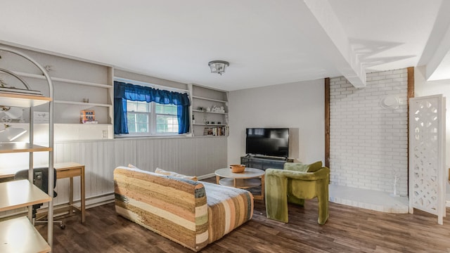 151 Stevenson Rd, Meriden, CT 06451 - living room with wood finished floors, brick wall, and built in features