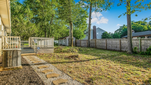 151 Stevenson Rd, Meriden, CT 06451 - fenced backyard with a deck and a storage unit