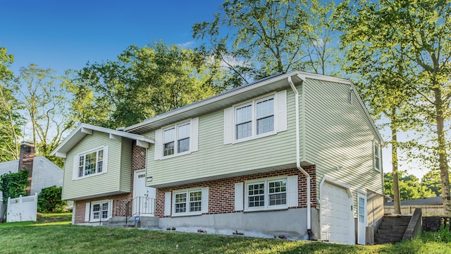 151 Stevenson Rd, Meriden, CT 06451 - view of front of property with brick siding and an attached garage