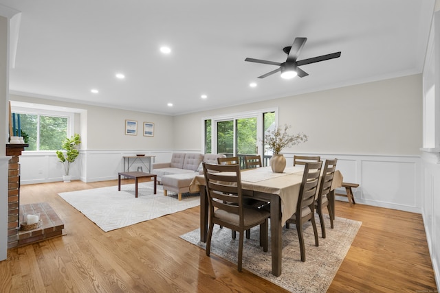 518 Iroquois Ln Unit A, Stratford, CT 06614 - dining area with ornamental molding, plenty of natural light, a decorative wall, a ceiling fan, and wainscoting