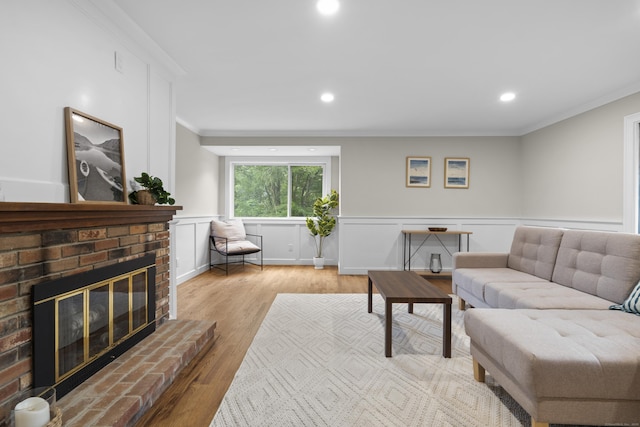 518 Iroquois Ln Unit A, Stratford, CT 06614 - living room featuring ornamental molding, wood finished floors, a fireplace, wainscoting, and recessed lighting