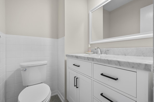 518 Iroquois Ln Unit A, Stratford, CT 06614 - bathroom featuring vanity, tile walls, and wainscoting