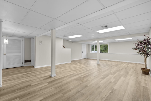 518 Iroquois Ln Unit A, Stratford, CT 06614 - below grade area featuring a paneled ceiling and light wood-type flooring
