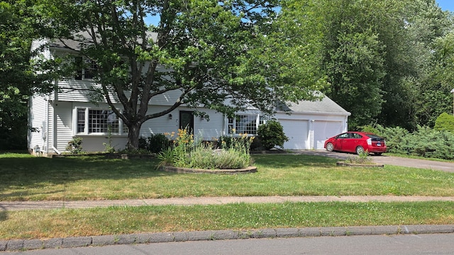 31 Glenwood Rd, Wethersfield, CT 06109 - view of property hidden behind natural elements featuring a front lawn, driveway, and a garage