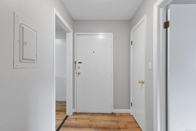 37 Enid St Apt C, Bridgeport, CT 06606 - hall featuring light wood finished floors and electric panel