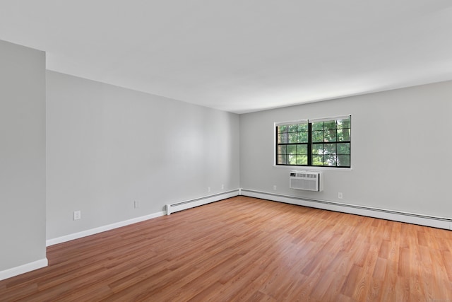 37 Enid St Apt C, Bridgeport, CT 06606 - empty room featuring wood finished floors, baseboard heating, and a wall unit AC