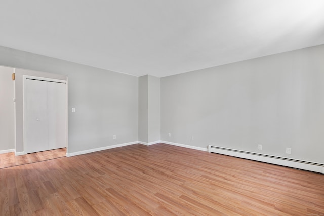 37 Enid St Apt C, Bridgeport, CT 06606 - spare room with light wood finished floors and baseboard heating
