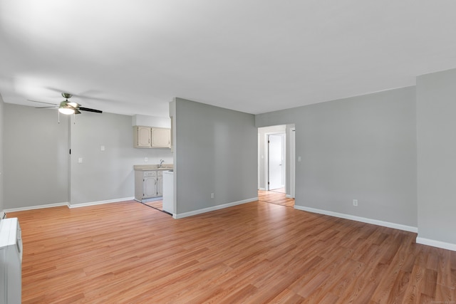37 Enid St Apt C, Bridgeport, CT 06606 - unfurnished living room with a ceiling fan and light wood-type flooring