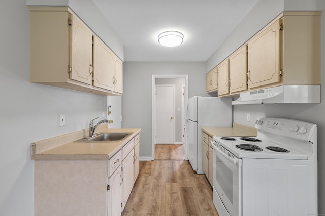 37 Enid St Apt C, Bridgeport, CT 06606 - kitchen with white appliances, under cabinet range hood, light countertops, and light wood-type flooring