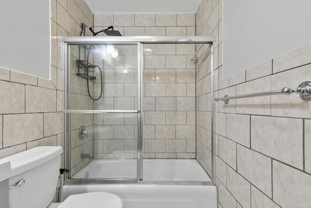 37 Enid St Apt C, Bridgeport, CT 06606 - bathroom featuring tile walls and enclosed tub / shower combo
