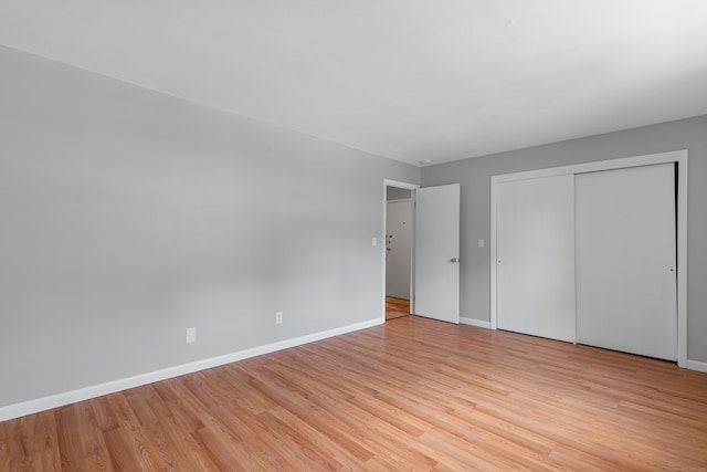 37 Enid St Apt C, Bridgeport, CT 06606 - unfurnished bedroom featuring light wood-style floors and a closet