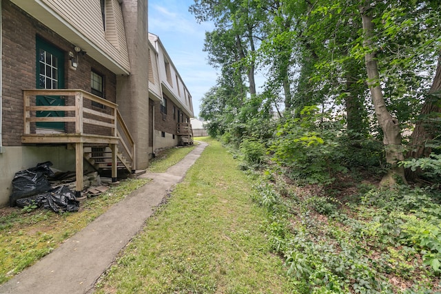 37 Enid St Apt C, Bridgeport, CT 06606 - view of grassy yard featuring stairs and a deck