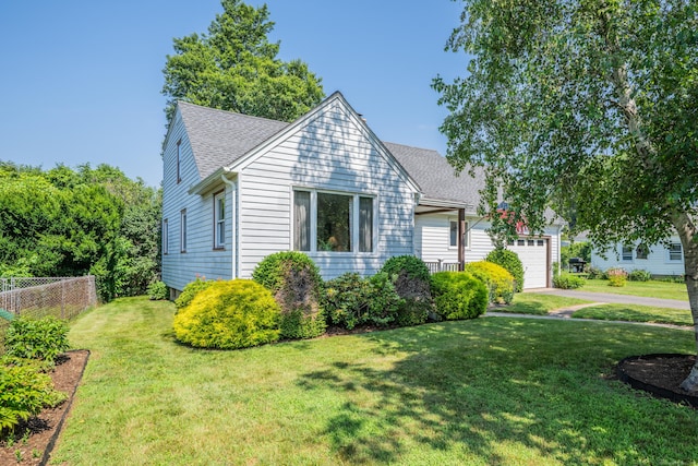 33 Hazel Ave, Naugatuck, CT 06770 - view of front of property featuring an attached garage, roof with shingles, and driveway