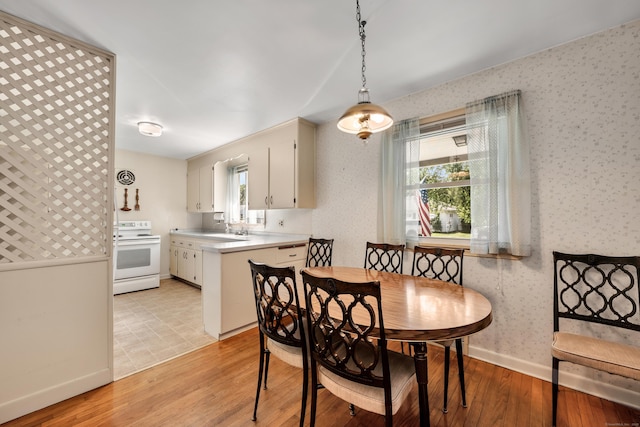 33 Hazel Ave, Naugatuck, CT 06770 - dining room with wallpapered walls and light wood-type flooring