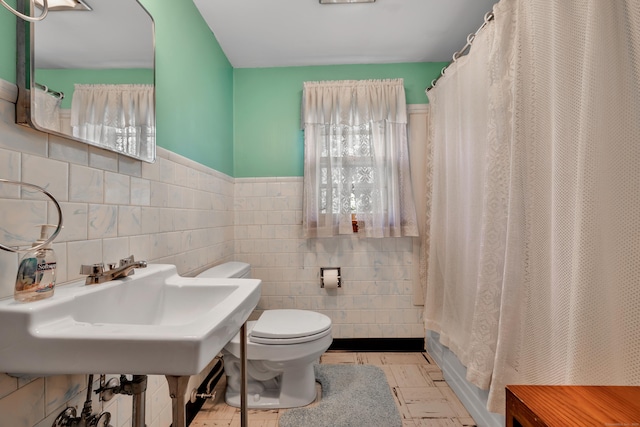 33 Hazel Ave, Naugatuck, CT 06770 - bathroom featuring tile walls, wainscoting, and shower / tub combo with curtain