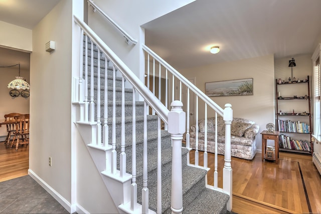 67 Nicole Dr, Naugatuck, CT 06770 - staircase featuring wood finished floors and a baseboard heating unit