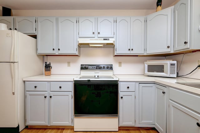 67 Nicole Dr, Naugatuck, CT 06770 - kitchen featuring white appliances, under cabinet range hood, light countertops, and white cabinetry