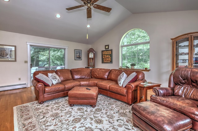 67 Nicole Dr, Naugatuck, CT 06770 - living room featuring a baseboard radiator, ceiling fan, vaulted ceiling, wood finished floors, and plenty of natural light