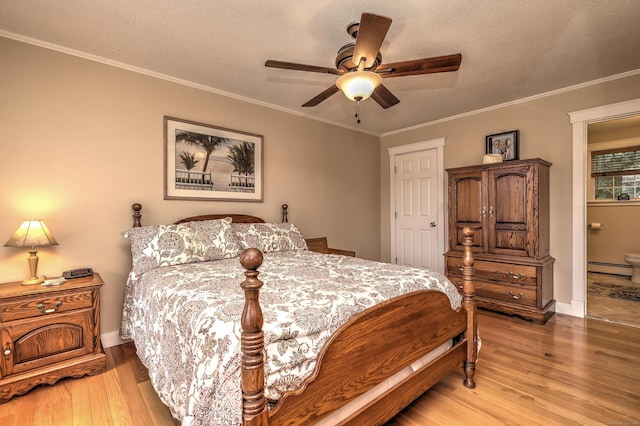 67 Nicole Dr, Naugatuck, CT 06770 - bedroom with light wood-style flooring, baseboard heating, a textured ceiling, ornamental molding, and ensuite bathroom