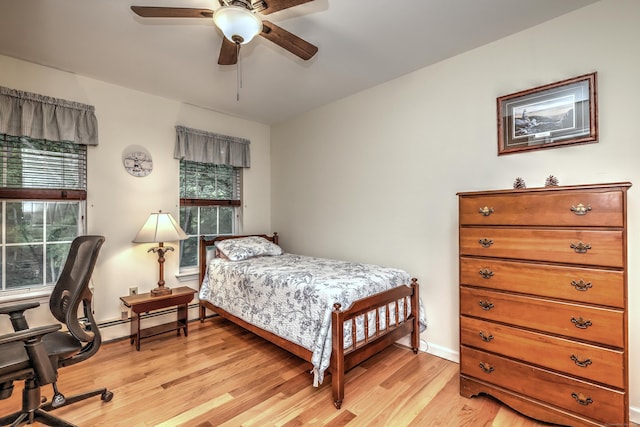 67 Nicole Dr, Naugatuck, CT 06770 - bedroom with light wood-type flooring, a baseboard heating unit, and ceiling fan