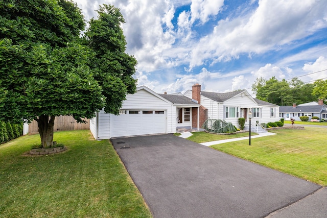 51 Euston St, New Britain, CT 06053 - view of front of home with asphalt driveway and a garage