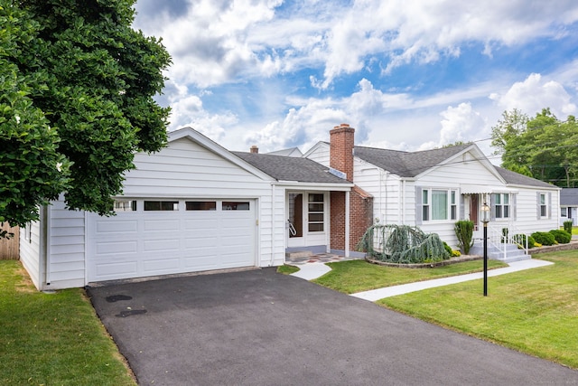 51 Euston St, New Britain, CT 06053 - view of front of home with driveway, a front yard, a garage, and roof with shingles