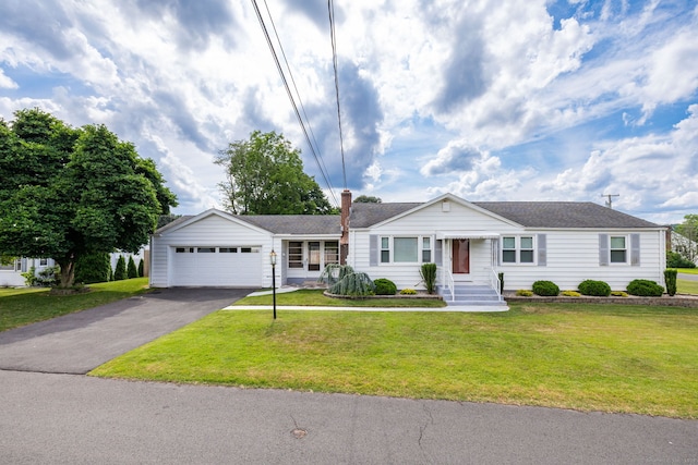 51 Euston St, New Britain, CT 06053 - ranch-style home featuring asphalt driveway, a garage, a front lawn, and a chimney