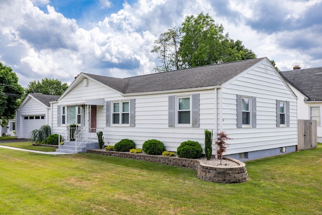 51 Euston St, New Britain, CT 06053 - ranch-style home featuring roof with shingles, a front yard, and a garage
