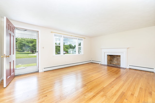 51 Euston St, New Britain, CT 06053 - unfurnished living room with a baseboard radiator, a baseboard heating unit, plenty of natural light, and light wood-style floors