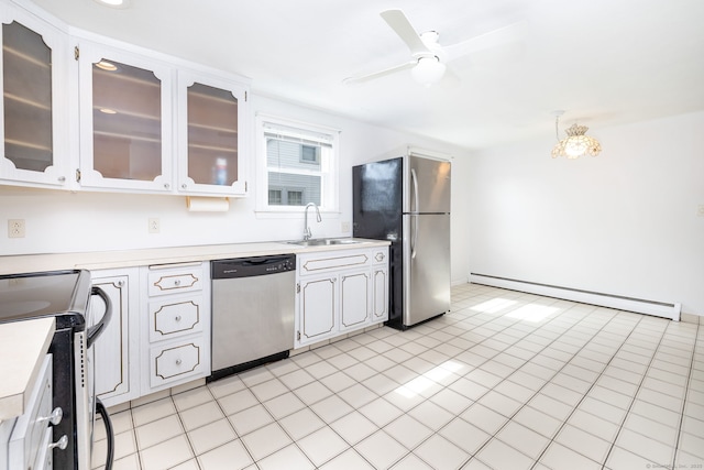 51 Euston St, New Britain, CT 06053 - kitchen with stainless steel appliances, a baseboard radiator, light countertops, a ceiling fan, and white cabinetry