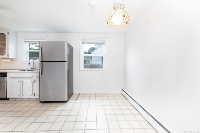 51 Euston St, New Britain, CT 06053 - kitchen with stainless steel appliances, a baseboard radiator, light countertops, and white cabinets