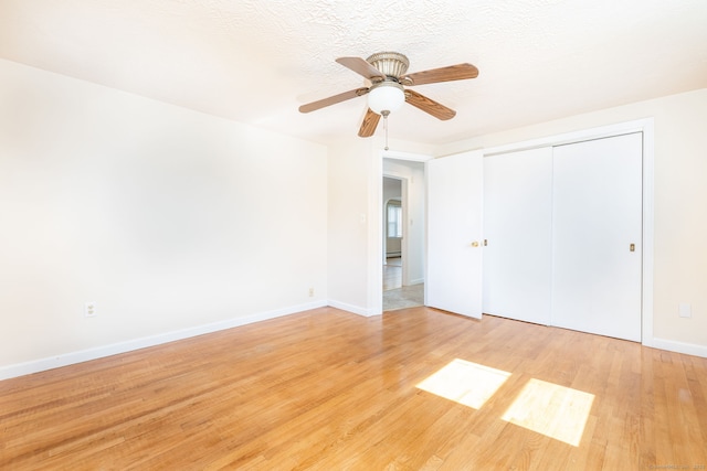 51 Euston St, New Britain, CT 06053 - unfurnished bedroom featuring light wood-style flooring, a closet, and a ceiling fan