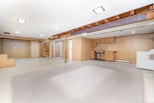 51 Euston St, New Britain, CT 06053 - finished basement featuring washer / clothes dryer, a baseboard radiator, wooden walls, stairway, and light flooring