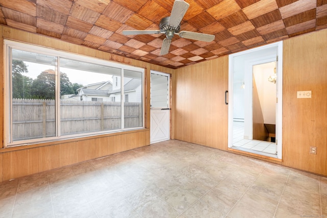 51 Euston St, New Britain, CT 06053 - spare room featuring healthy amount of natural light, wooden walls, a baseboard heating unit, ceiling fan, and wooden ceiling