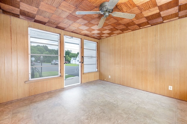 51 Euston St, New Britain, CT 06053 - empty room featuring wooden walls and ceiling fan
